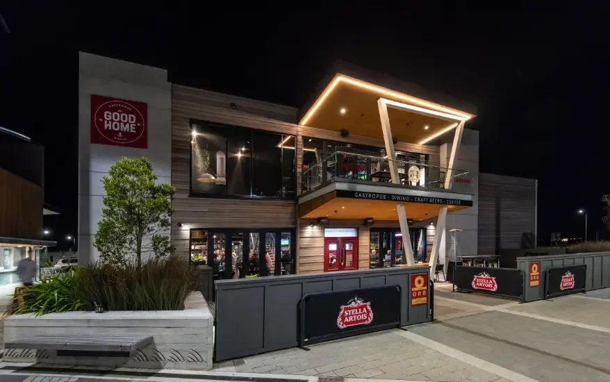 The Good Home Wigram gastropub exterior illuminated at night