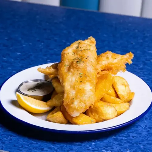 Battered fish served with chunky chips at Fush Wigram