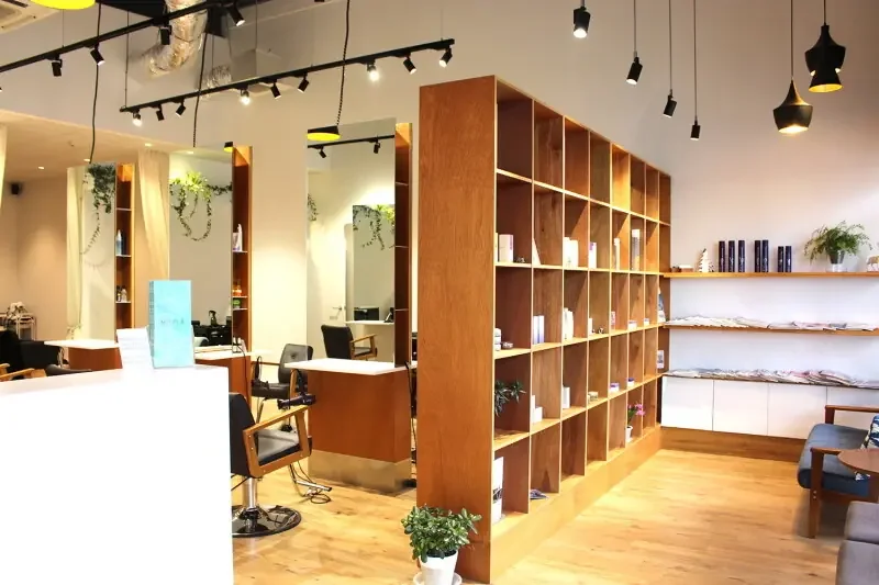 Interior of Misola Hair & Style in Wigram with styling chairs, mirrors and haircare products