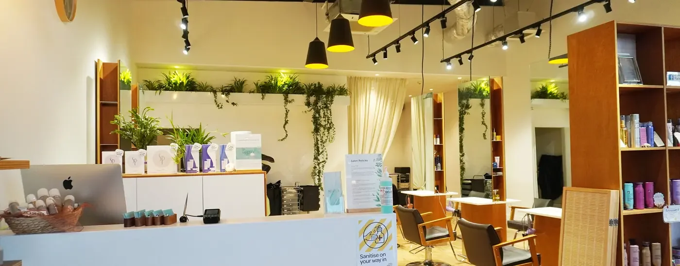 Misola Hair & Style salon interior with wooden styling stations and product displays