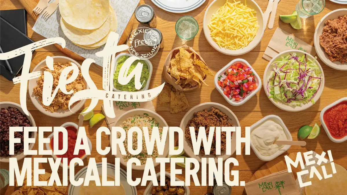 Mexicali Fresh catering spread with tacos, chips, salsa and fresh toppings