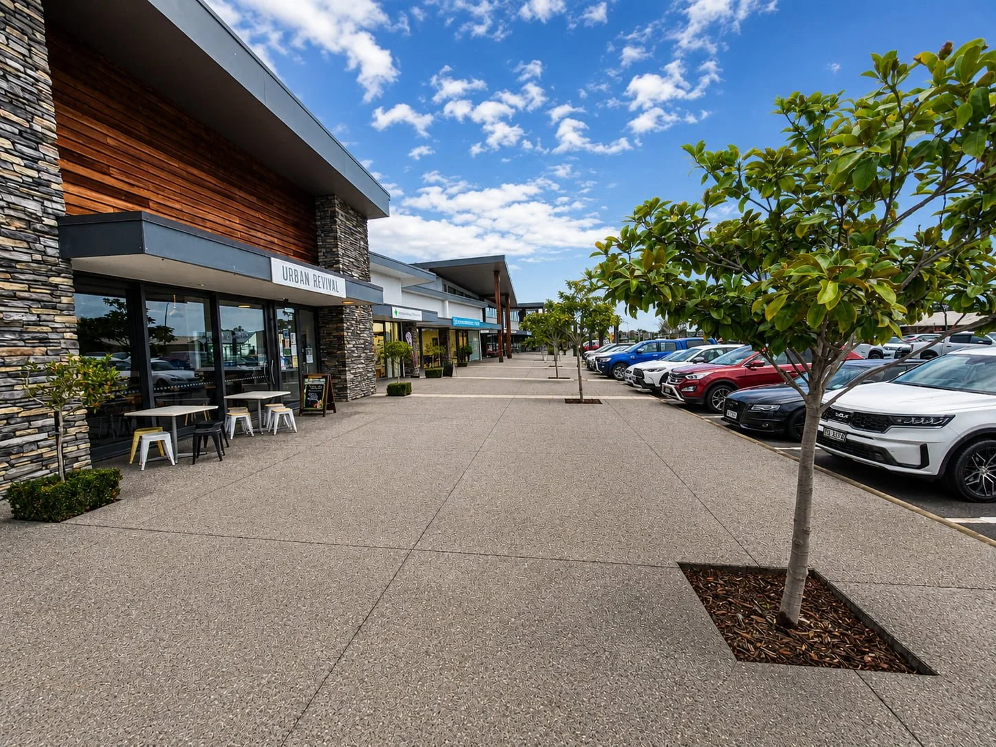 Outdoor shopping promenade and customer parking at Silverstream Retail Village in Kaiapoi.