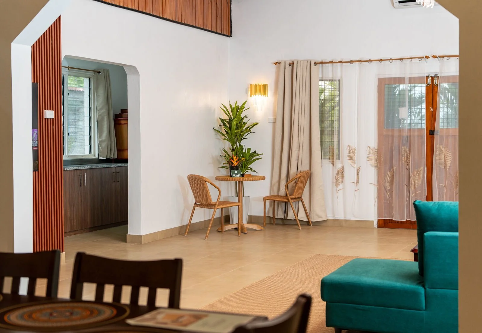 Open-plan living and dining room at the Garden Flat in Nakasi, space for a family celebration after graduation in Suva
