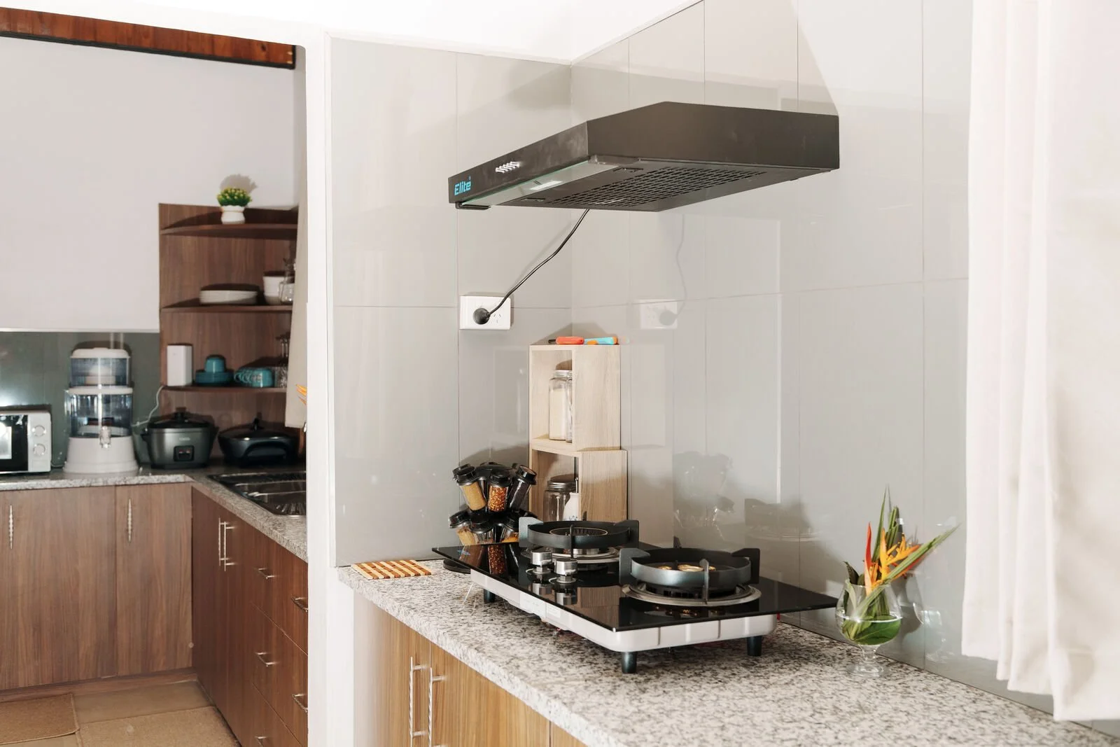 Fully equipped kitchen with gas stove, rice cooker and crockery at the Garden Flat, Nausori, for monthly stays