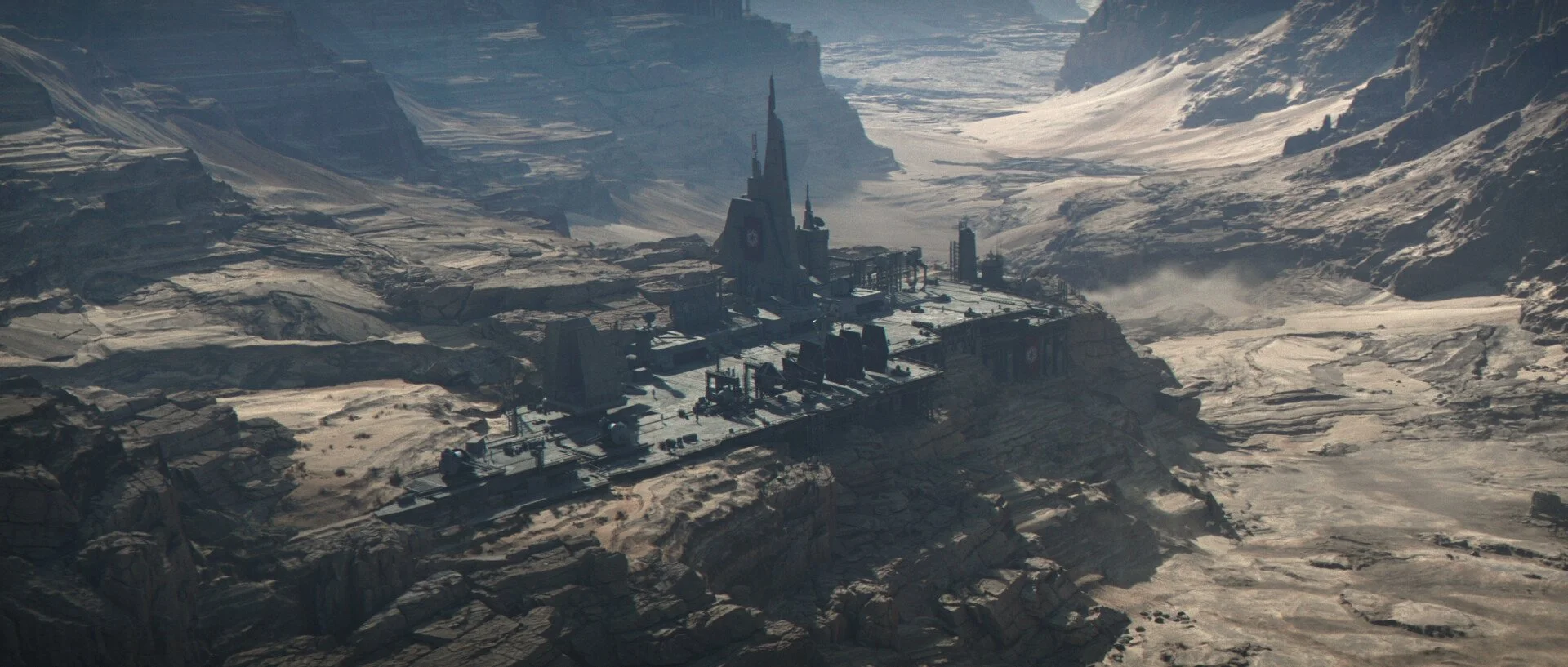 A large, futuristic industrial facility or spaceship on a rocky, icy mountain landscape with snow and glacier-covered terrain in the background.