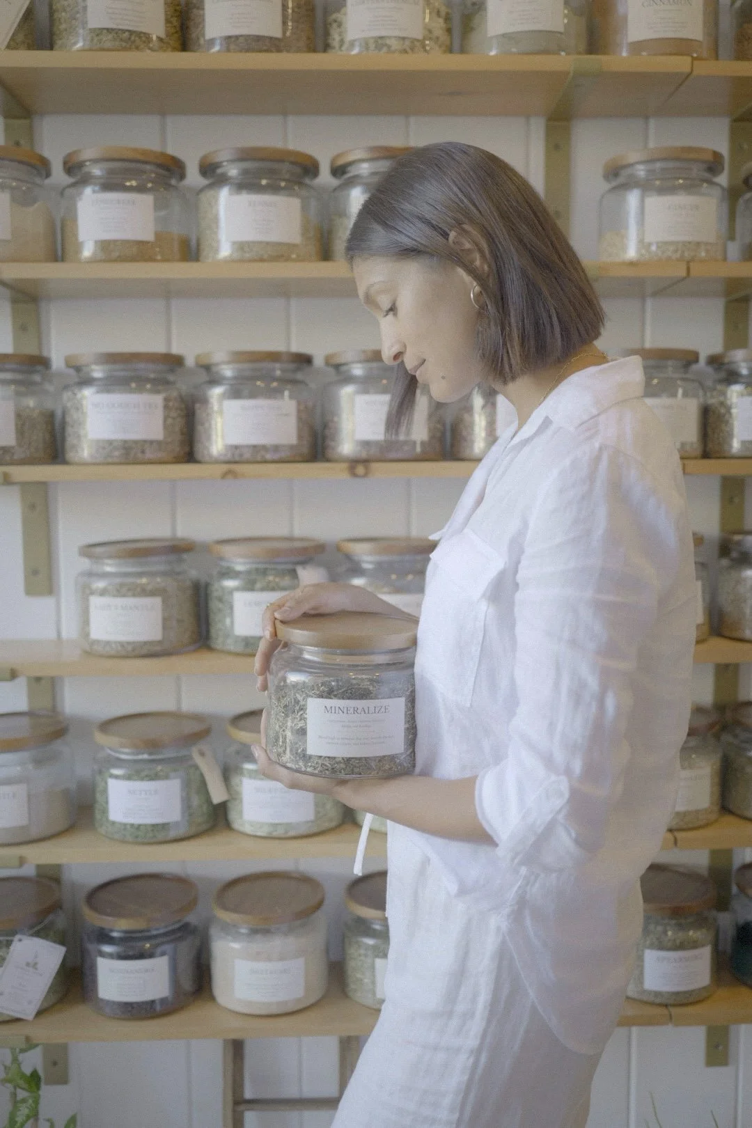Dr. Brisa Mahoney in an herbal apothecary