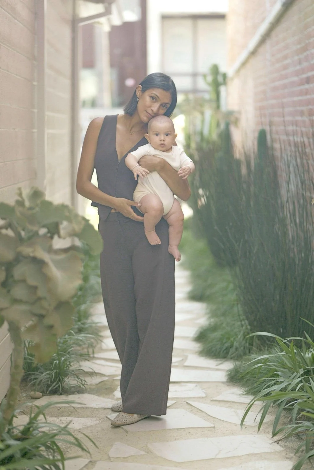 Dr. Brisa Mahoney, ND, holding a baby