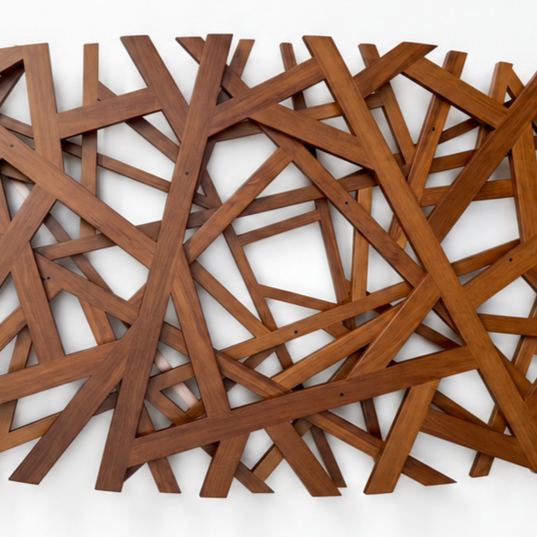 Wooden+sculpture+on+a+pristine+gallery+wall.png