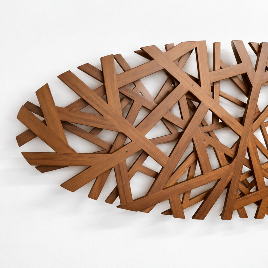 Wooden+sculpture+on+a+white+wall.png