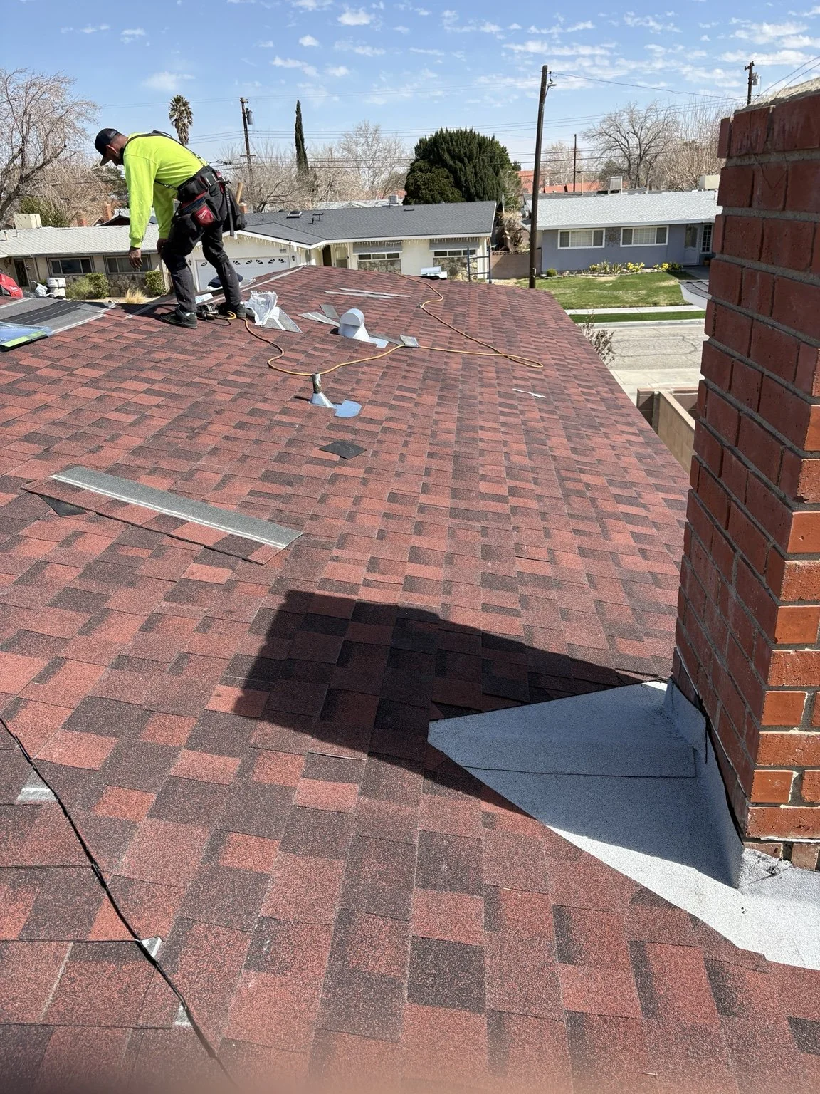 Finished residential shingle roofing project completed by American Made Construction.