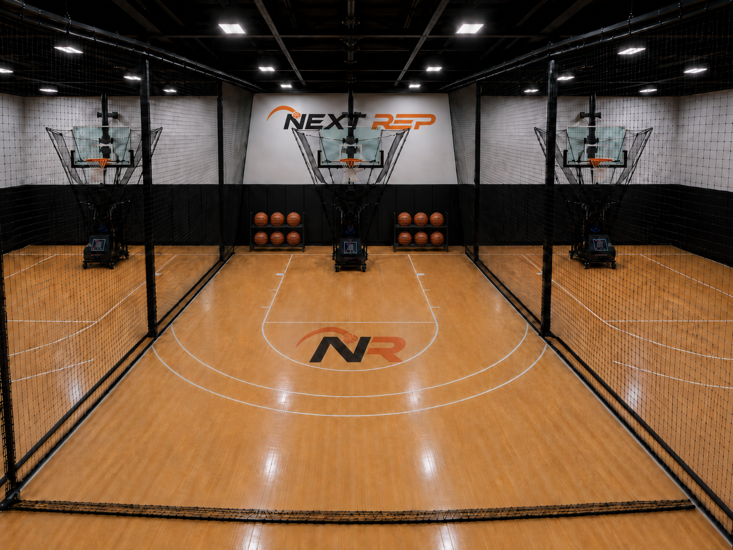 Next Rep Basketball shooting bays with Dr. Dish machines, netting dividers, and hardwood flooring