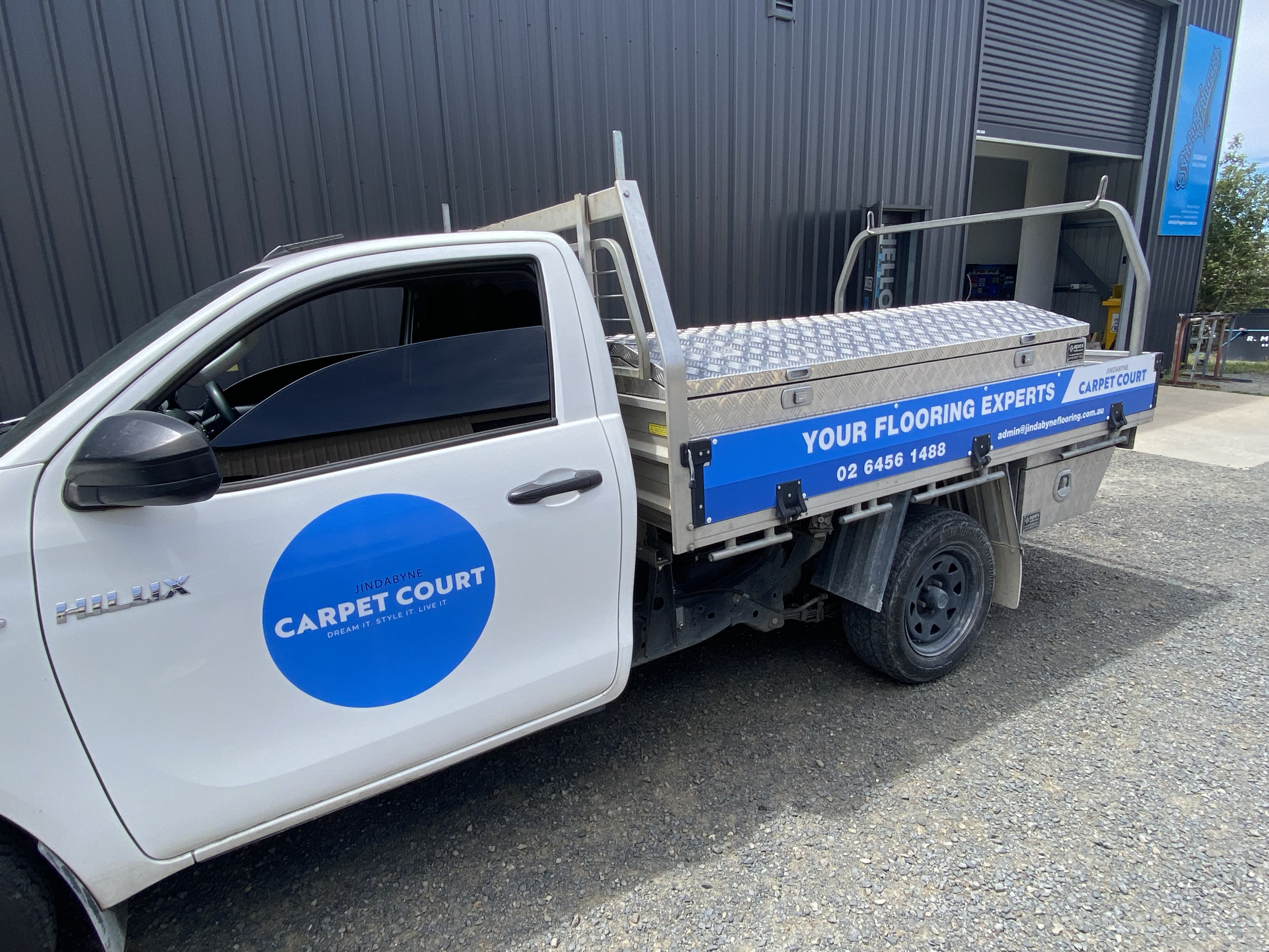 Carpet Court – Vehicle door decals and tray signage.