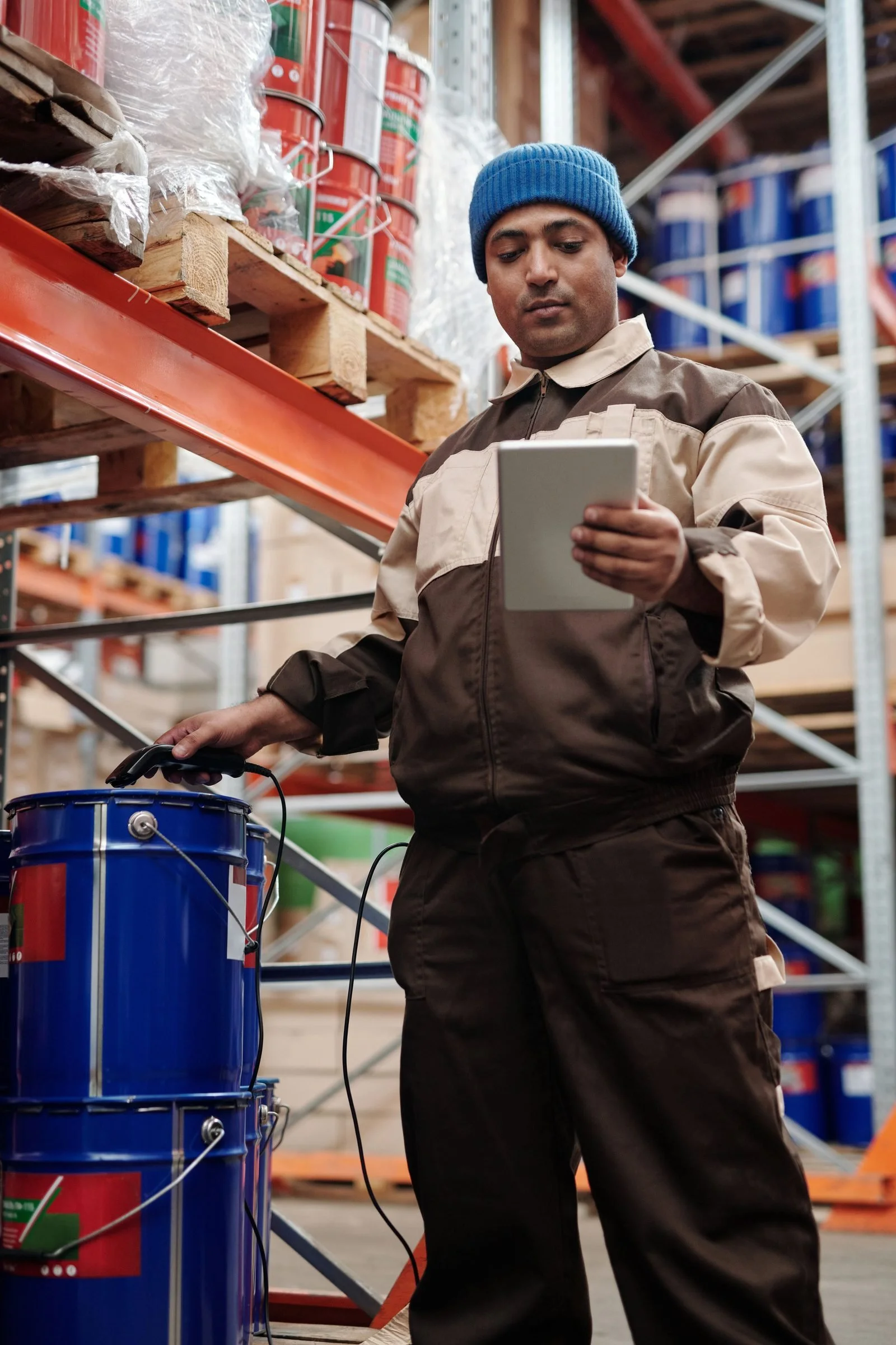Technician checking equipment against a tablet checklist