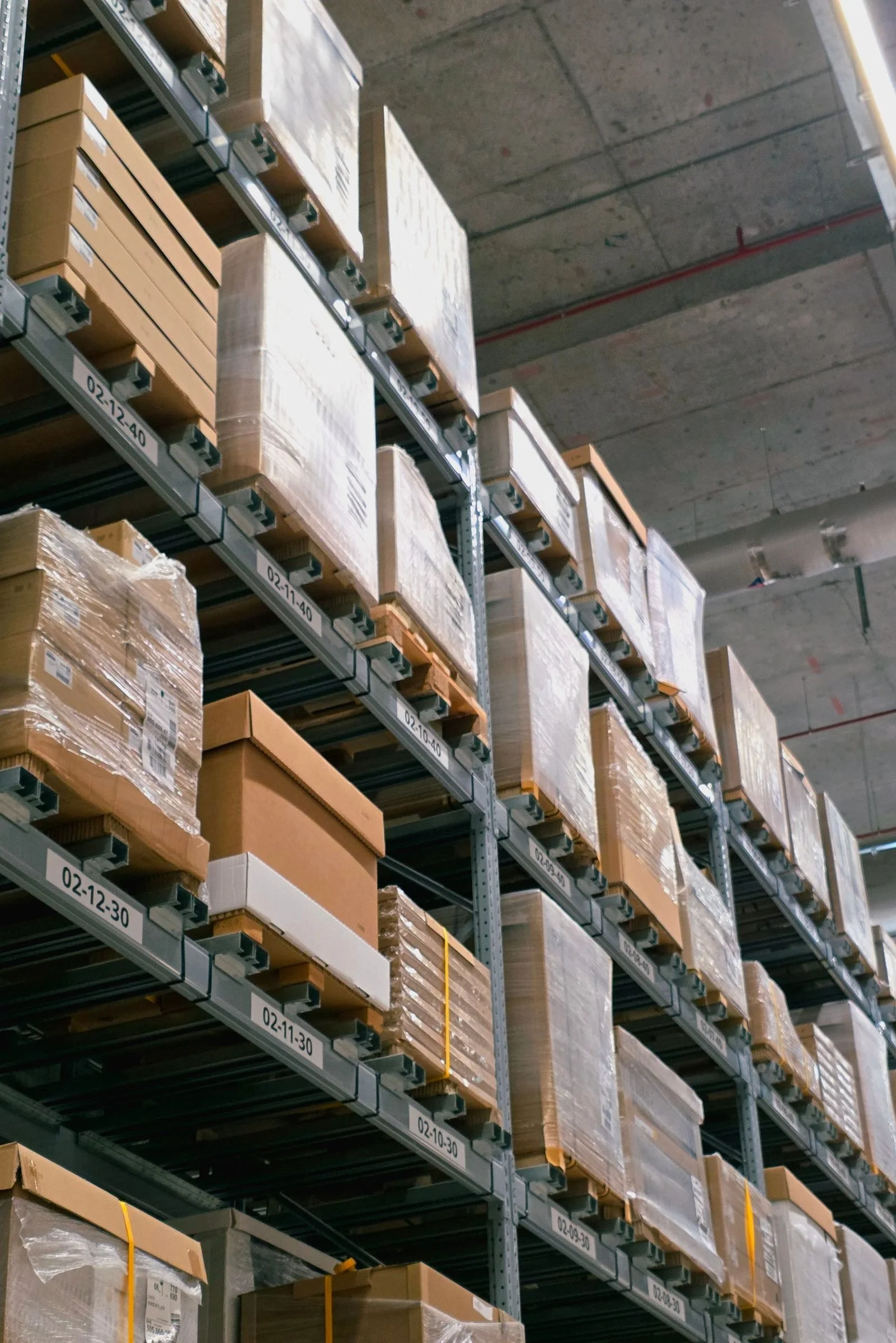 Rows of racked storage running the length of a warehouse