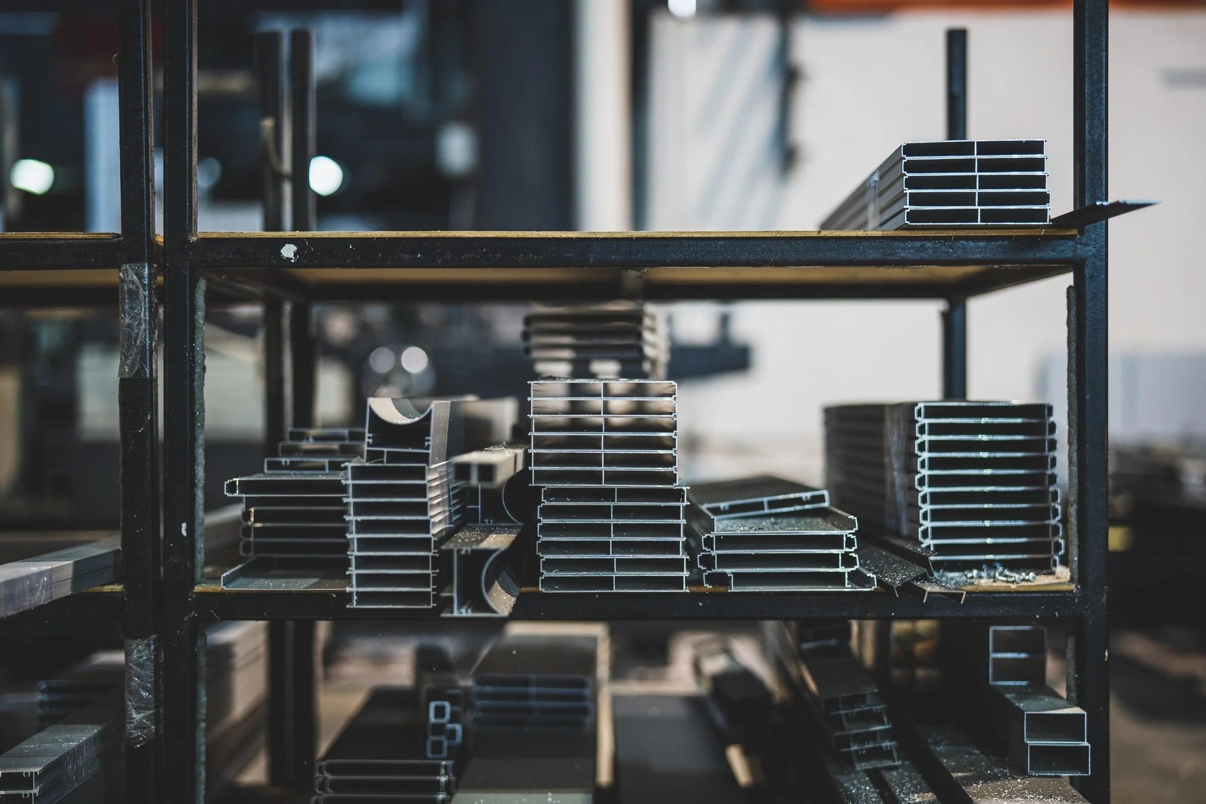 Stacked steel stock racked in a warehouse