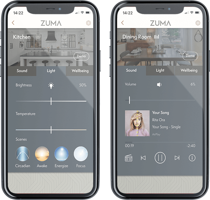 Zwei Smartphones zeigen die ZUMA-App zur Steuerung von Licht, Sound und Wellness in Küche und Esszimmer, einschließlich Lautstärkeregelung, Musiksteuerung und Helligkeitseinstellung.