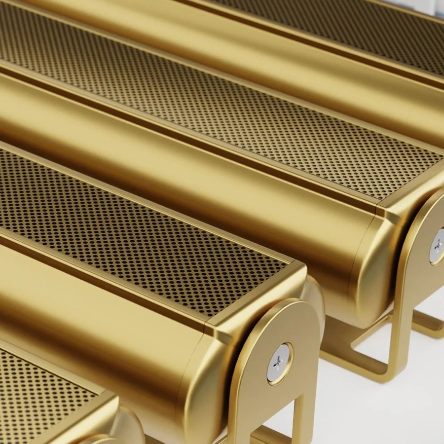 Nahaufnahme von goldfarbenen Rollen mit perforierten Oberflächen