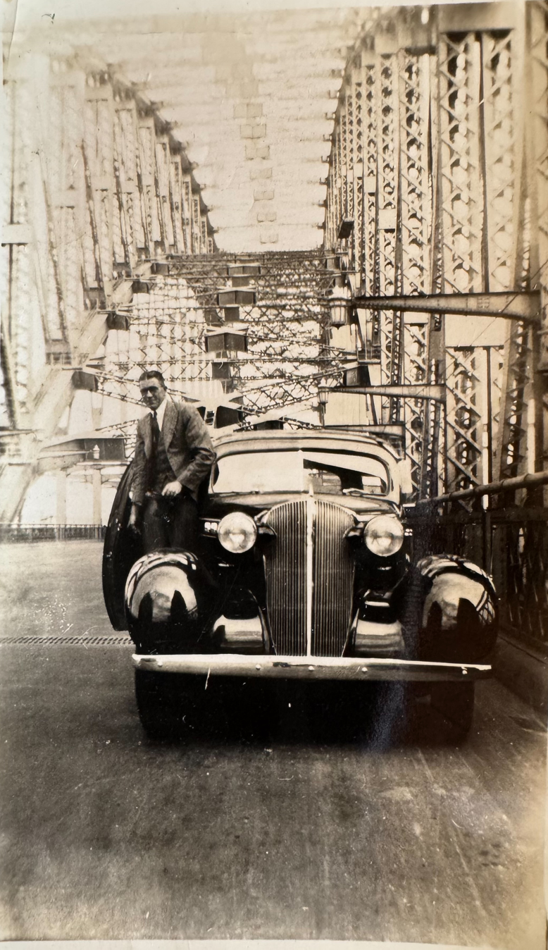 Ray Baker driving across Sydney Harbour Bridge 1936