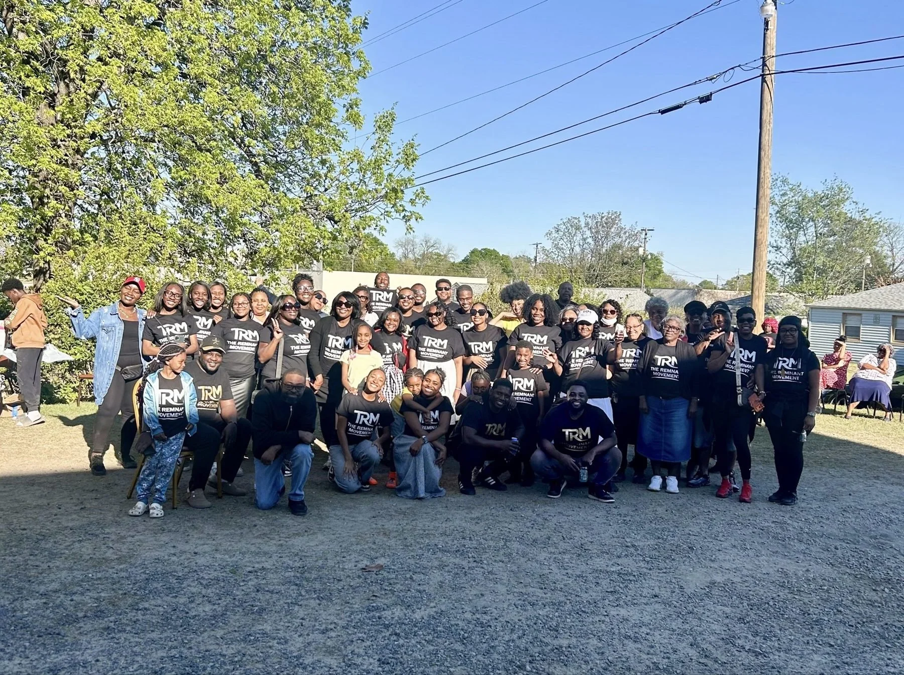 The Remnant Movement church family gathered outdoors for a group photo in Cayce, SC