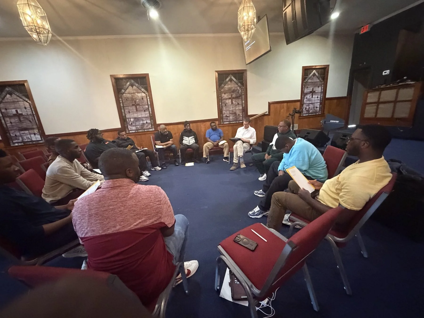 Church members joined in a prayer circle at The Remnant Movement