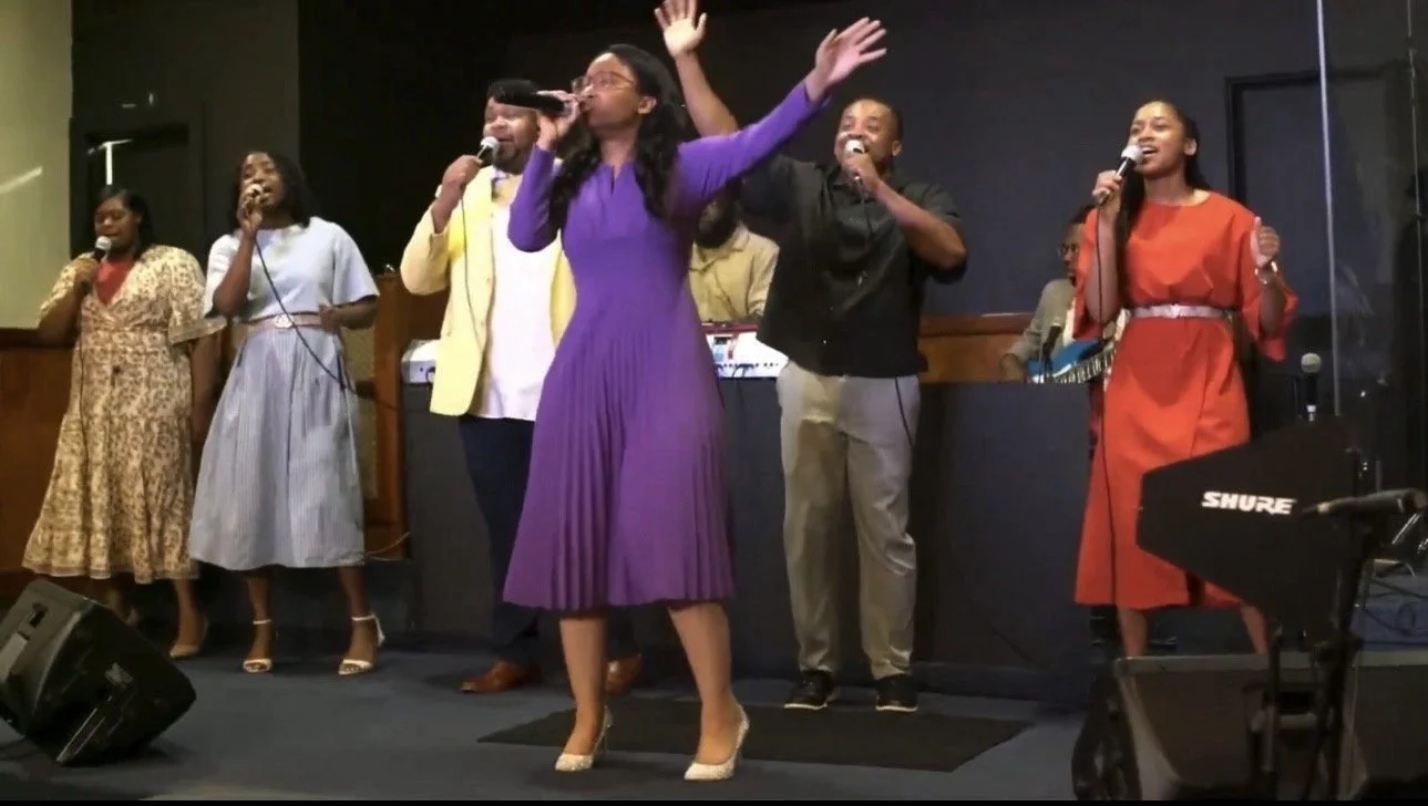Praise team leading worship at The Remnant Movement