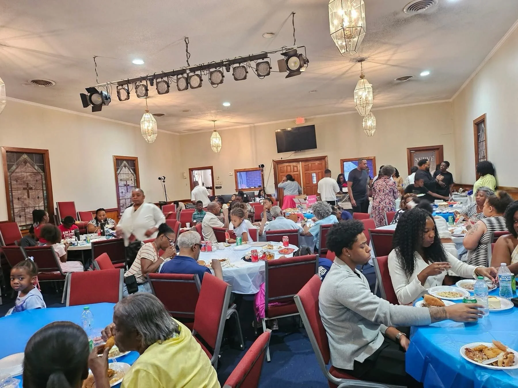 Church family sharing a fellowship dinner at The Remnant Movement