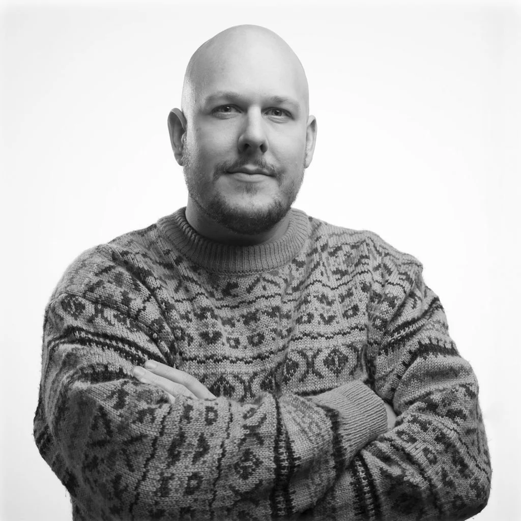 A black and white portrait of artist and Kindred Cameras co-founder Chris Bowes.