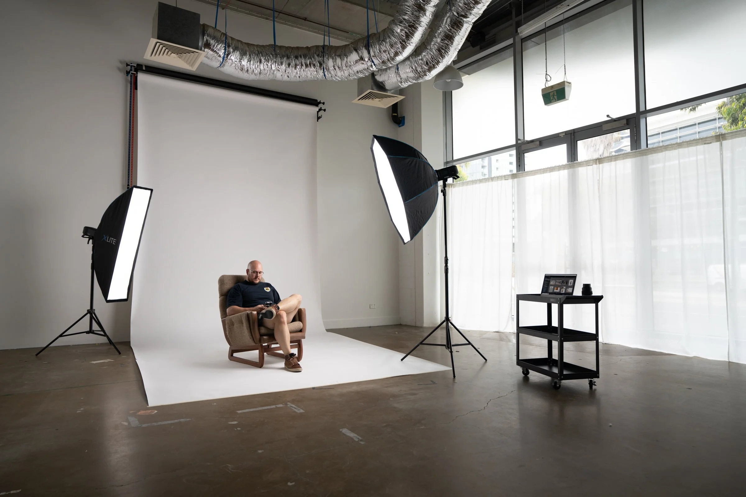 Photo studio available for hire at Kindred Cameras in Docklands, Melbourne. Features natural light and concrete floors.