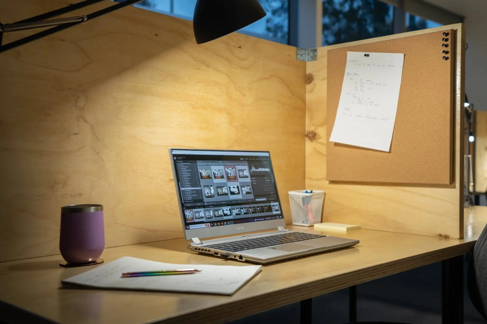 Dedicated members workspace at Great Space with a hot desk, editing workstation, task lighting, and private workspace for photography post-production.