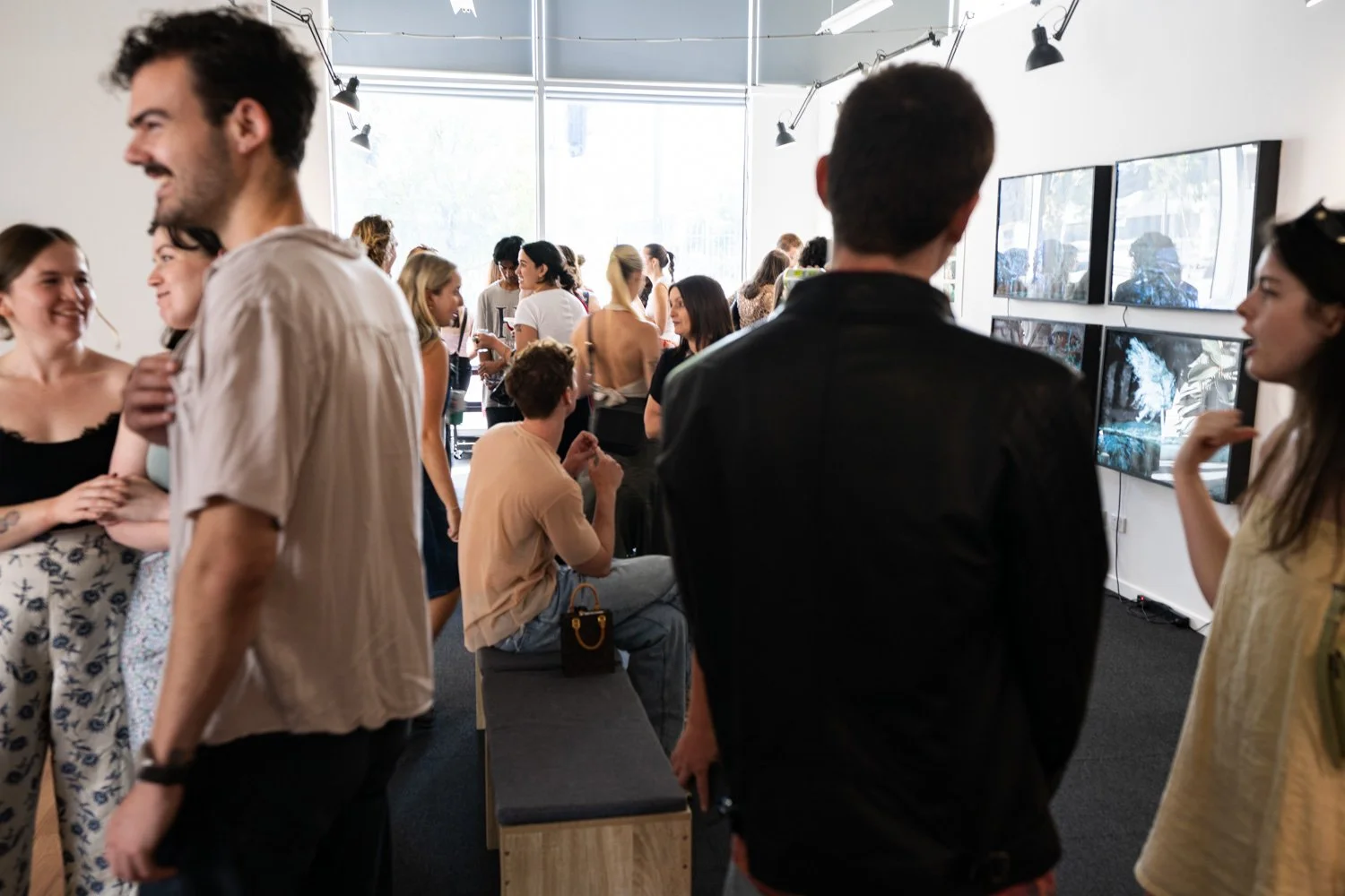 Visitors at an exhibition opening at Great Space Gallery in Docklands