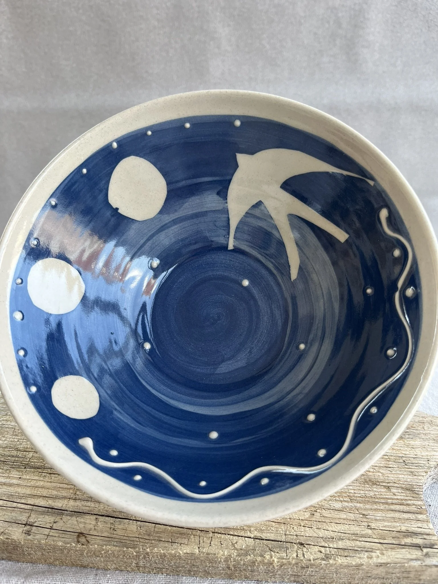 Bird blue with three suns