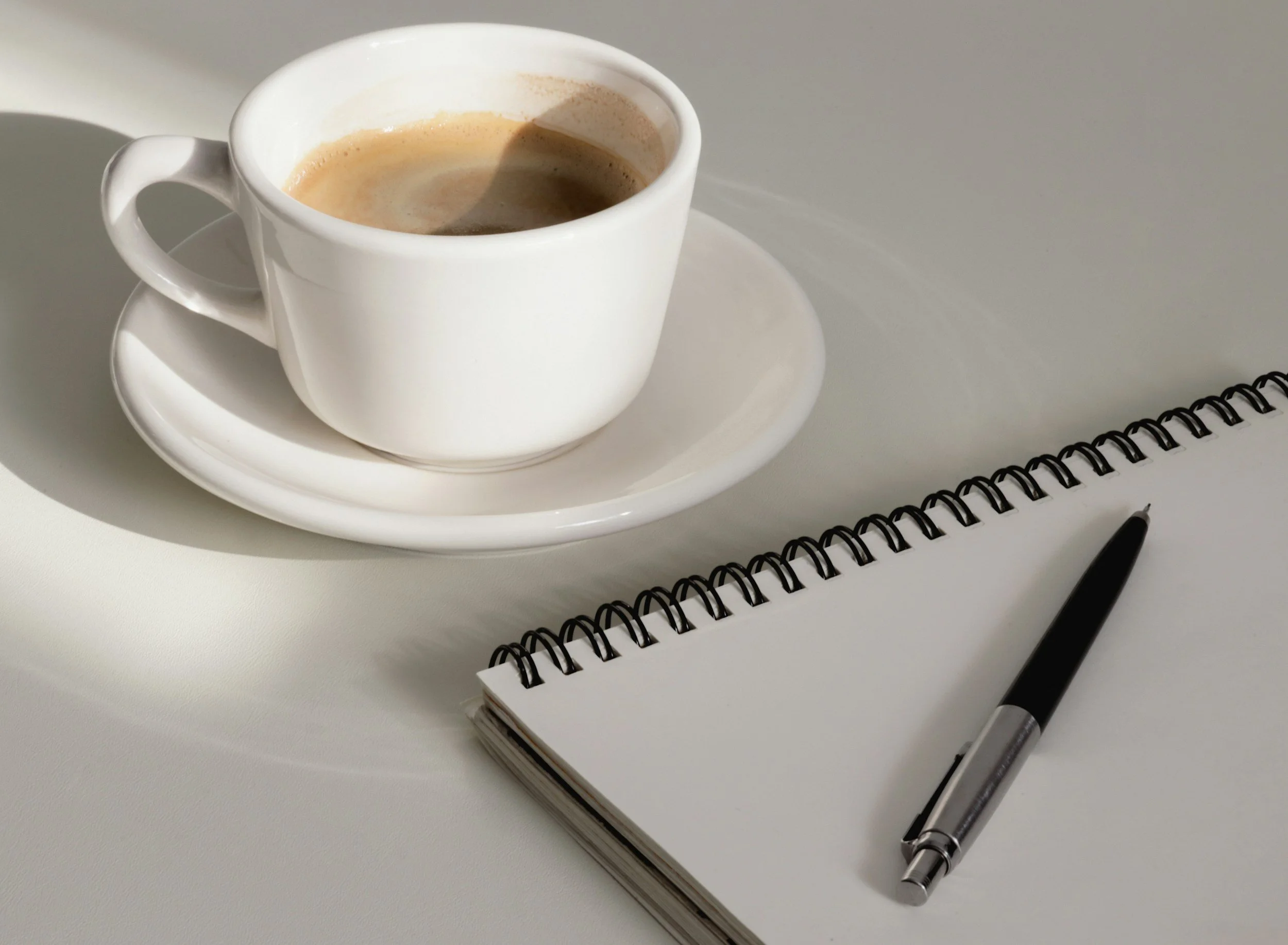 Coffee and notebook beside the contact form
