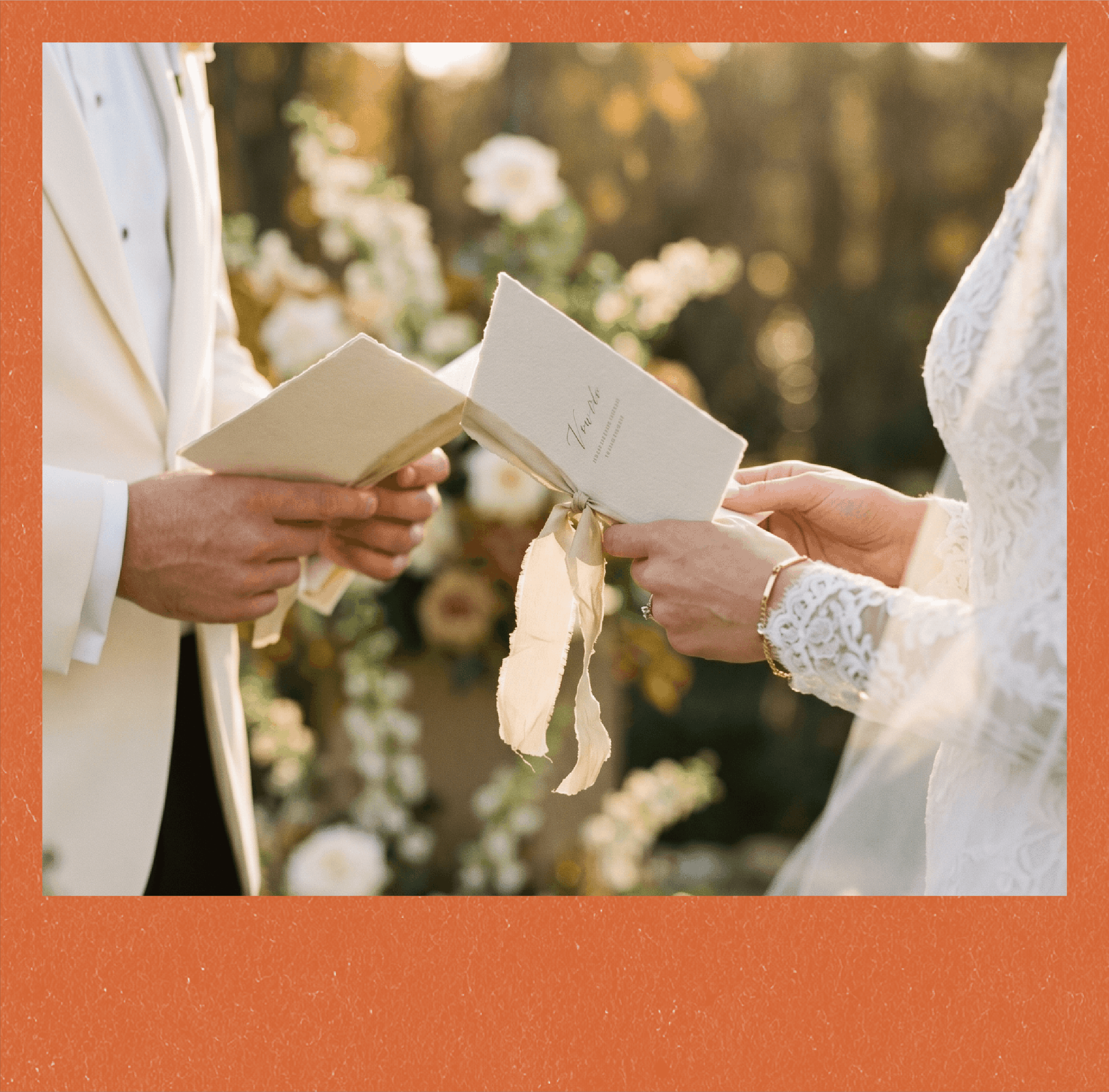 A couple exchanging wedding vows outdoors, holding hands and reading from small notebooks, with warm sunlight filtering through trees.