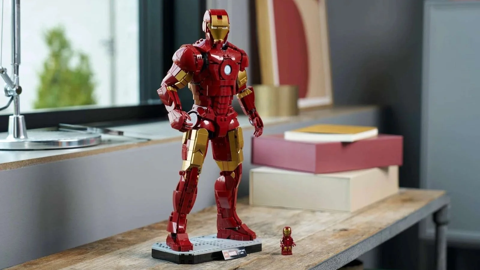 LEGO Iron Man Mark 3 Collectors' Edition figure posed on a wooden counter beside a bright window
