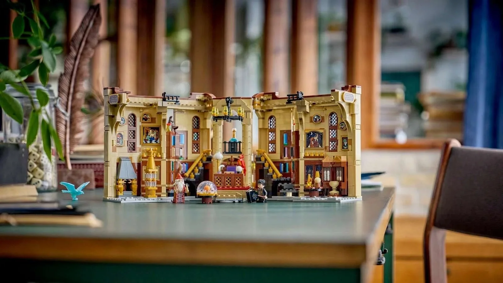 LEGO Book Nook: Dumbledore's Office set open on a table with Dumbledore and Harry minifigures standing in front