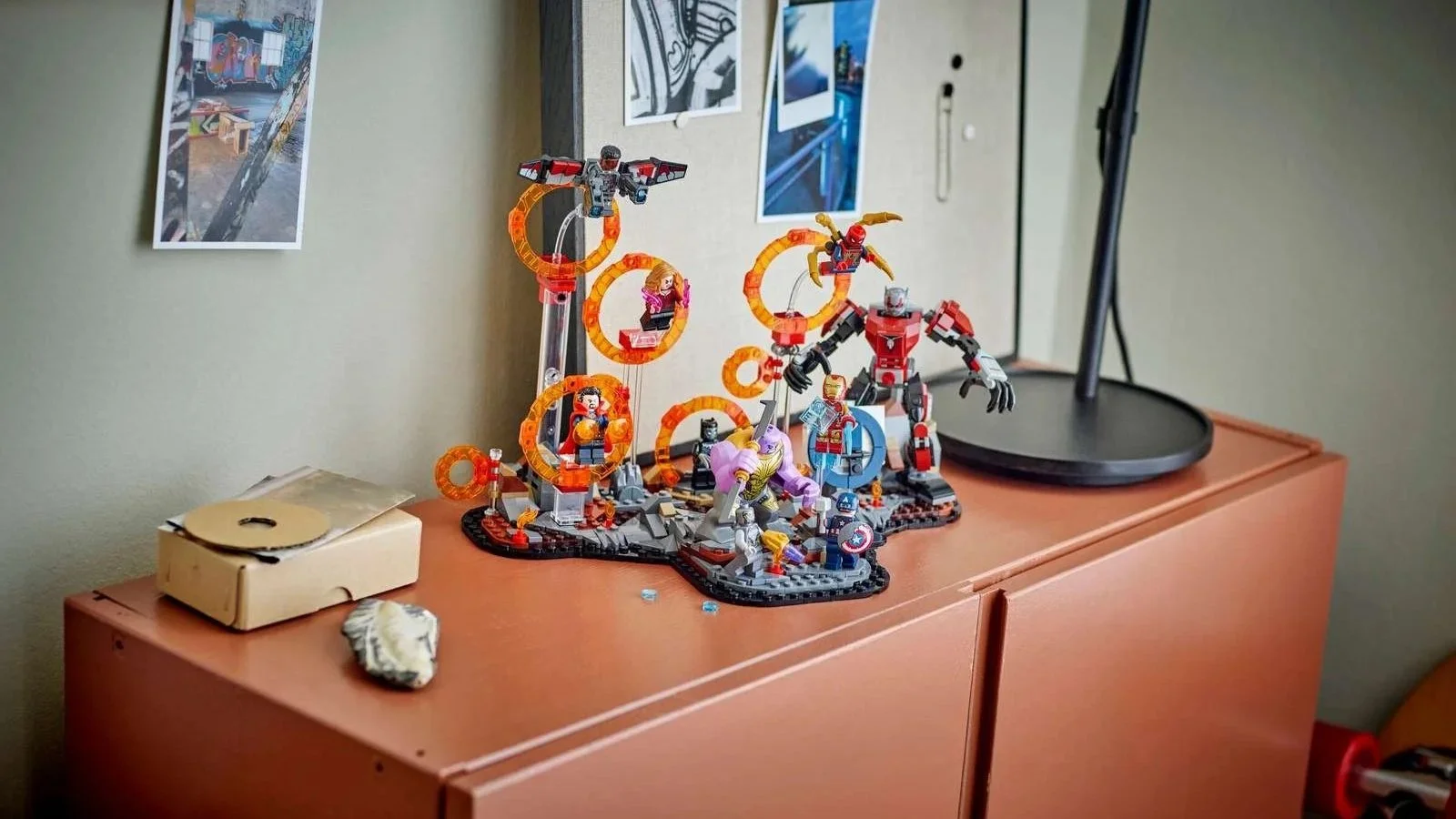 LEGO Marvel Avengers: Endgame Final Battle set with orange portals and minifigures on a terracotta bedroom cabinet