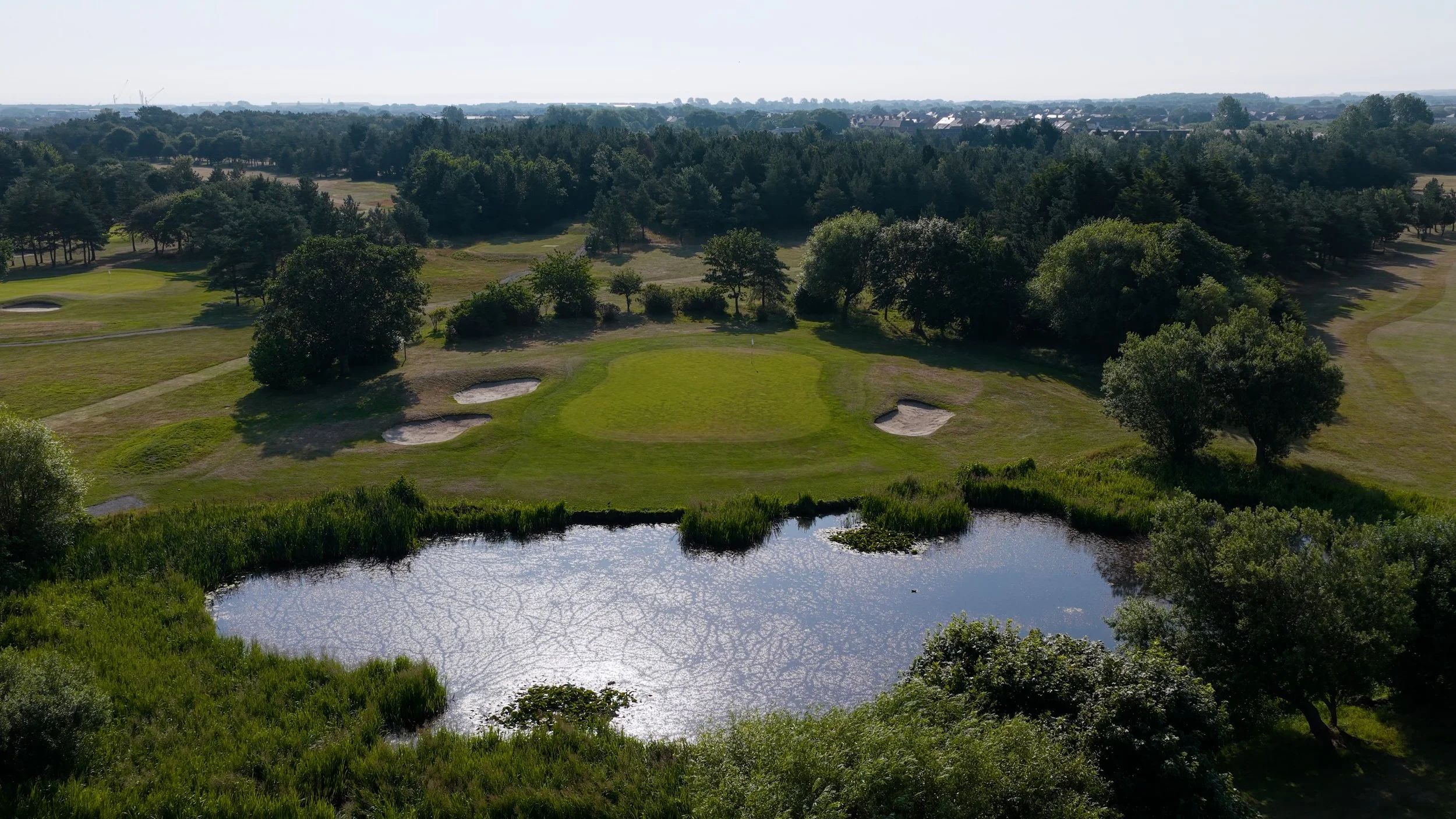 Aerial view of the 13th green at Blyth Golf Club, across the pond