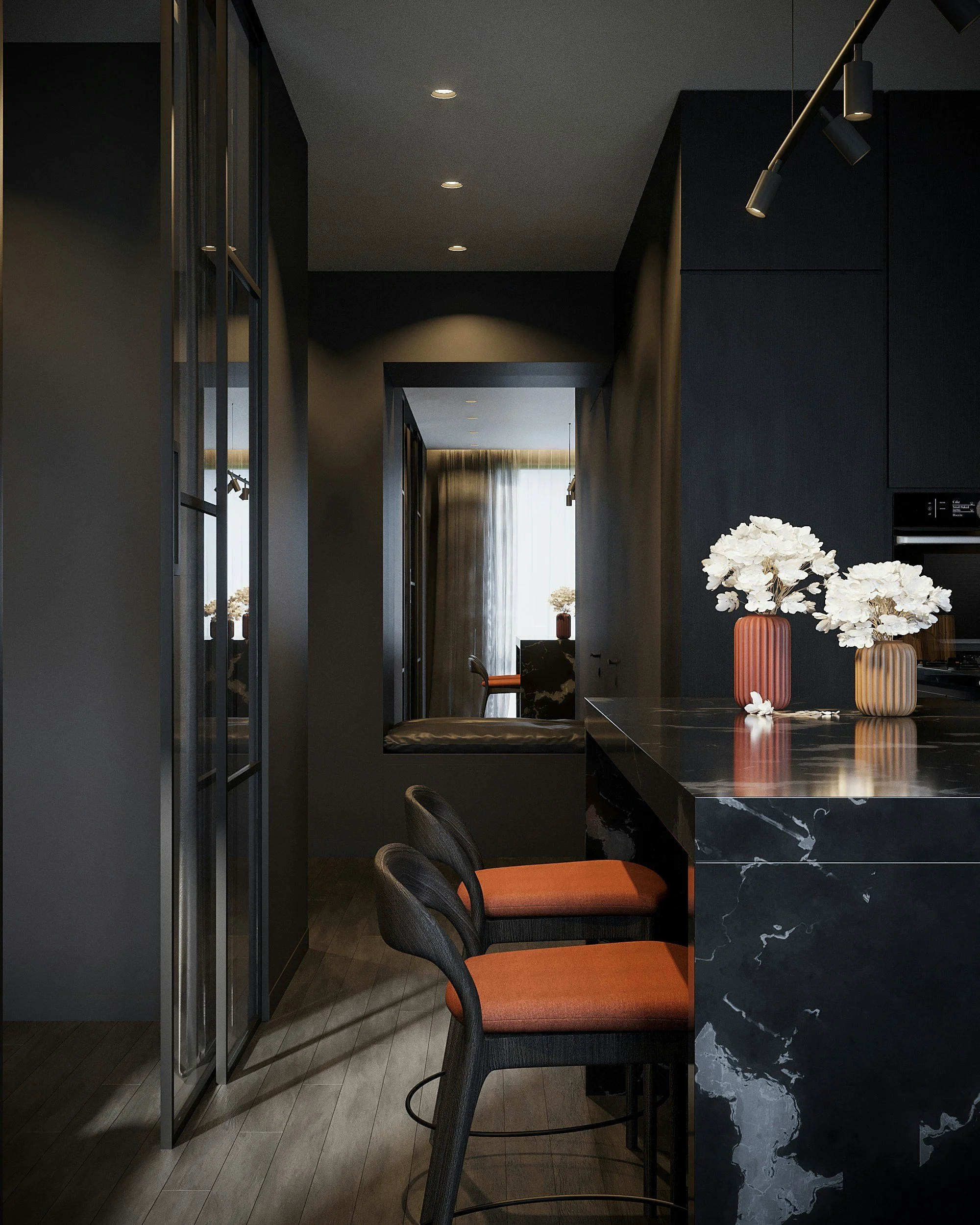 Modern kitchen interior with black marble island and orange upholstered chairs, white floral arrangements in vases, dark cabinetry, and a window with sheer curtains in the background.