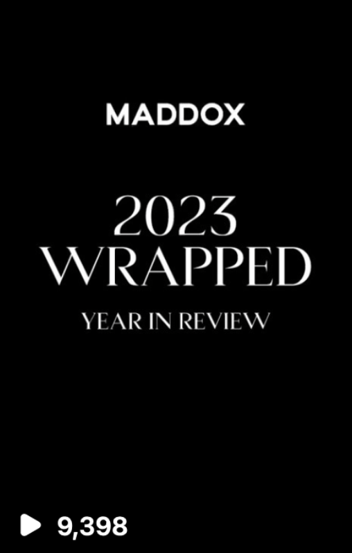 Black background with white text that reads "MADDOX 2023 WRAPPED YEAR IN REVIEW" and a play icon with a count of 9,398 views at the bottom.