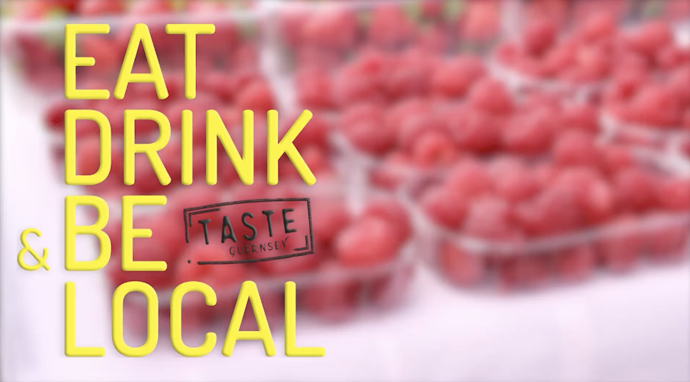 Text overlaying a background of pinkish-red berries that reads 'EAT, DRINK, BE, LOCAL' with a smaller stamp-like text that says 'TASTE GUERNSEY'.