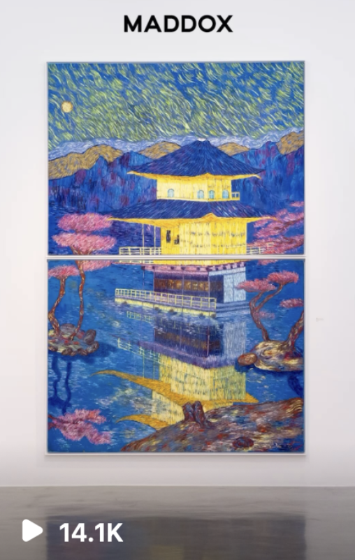 A colorful painting by Maddox depicts a landscape with two yellow buildings, pink blossom trees, a mountain range in the background, and a starry night sky with a bright moon. The scene is reflected in a body of water below.