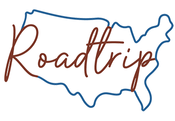 An outline of the United States in blue with the word "Roadtrip" written inside in cursive red font.
