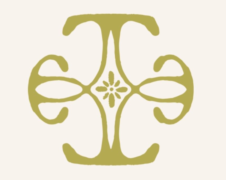 A symmetrical, decorative floral pattern in olive green with a central flower motif, set against a cream background.