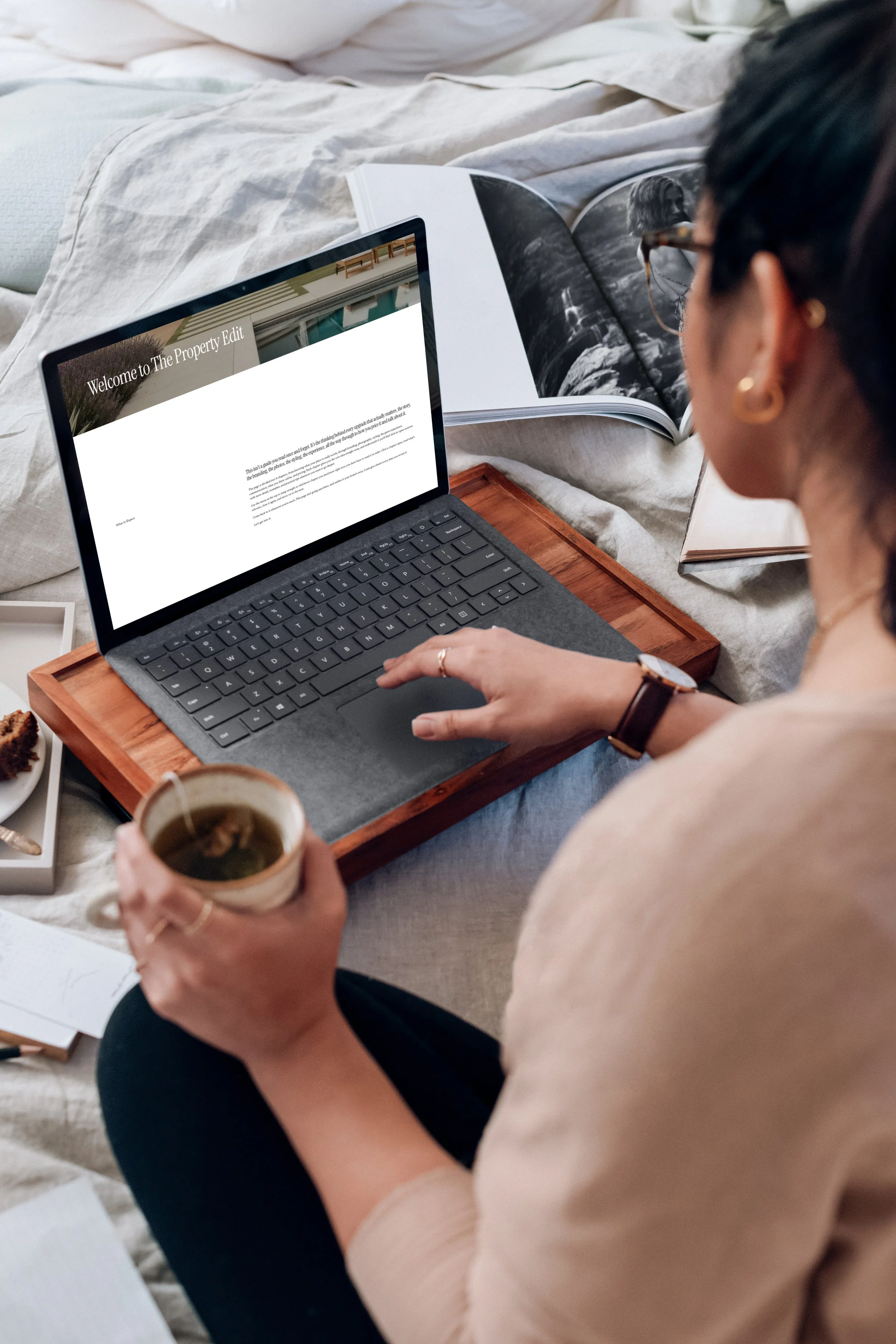 mockuuups-microsoft-surface-laptop-mockup-used-by-a-lady-on-a-wooden-slab.jpeg