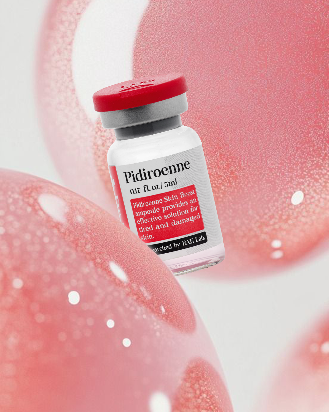 A small vial labeled 'Pidiroenne' with a red cap, surrounded by pink and white textured balls or objects.