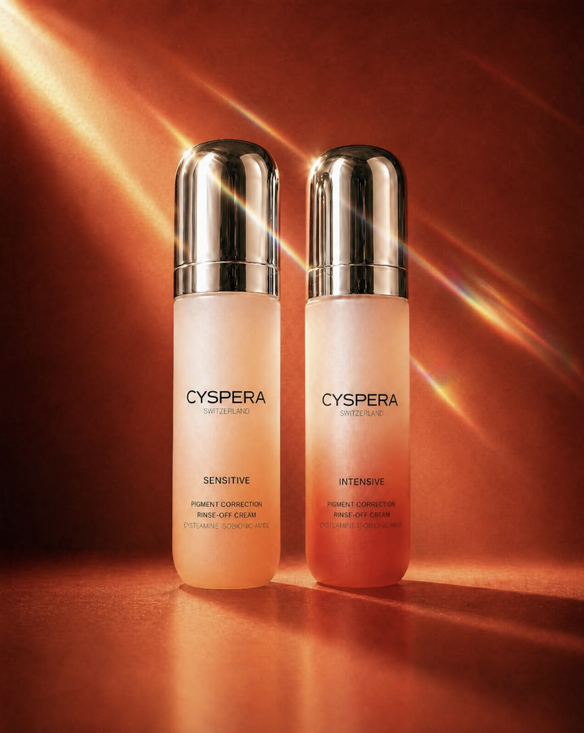 Two bottles of skincare product labeled 'CYSERA Switzerland,' one marked 'Sensitive' and the other 'Intensive,' with gradient-colored backgrounds and reflective caps.