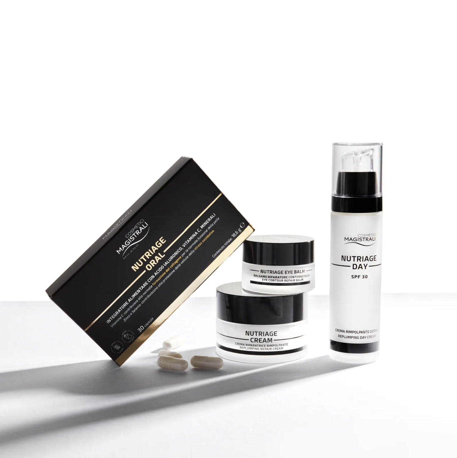 Skin care products including Nutriage eye balm, day cream, and supplements, along with capsules, on a white surface with shadows.
