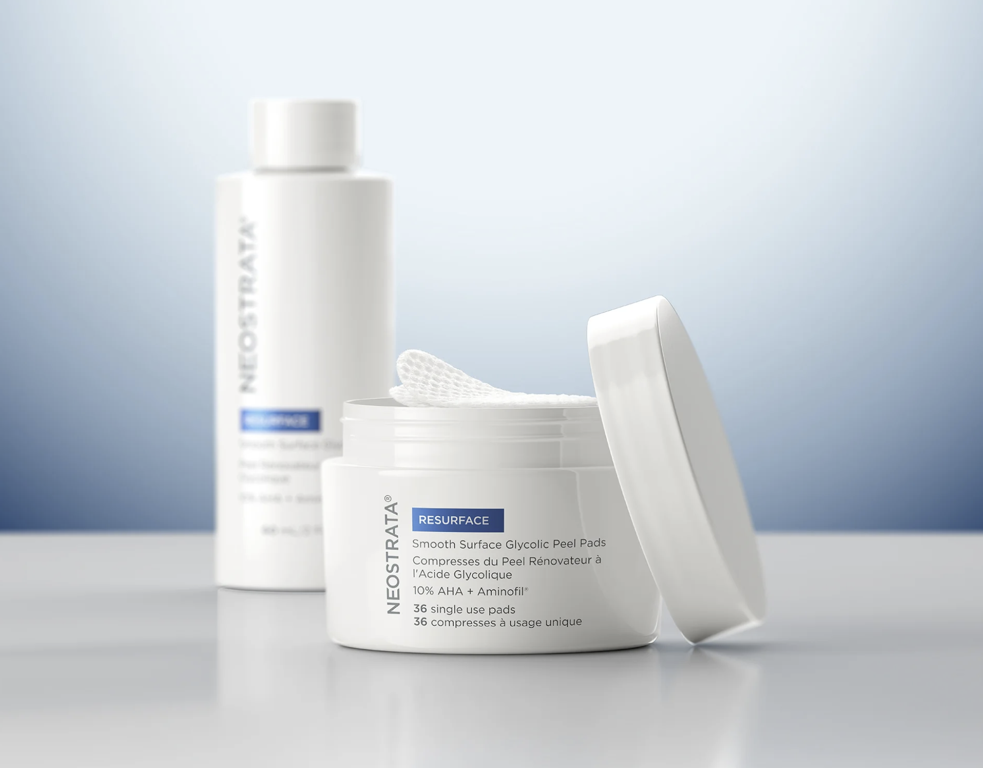 Open container of Neostrata Resurface glycolic peel pads with one pad partially removed, placed on a plain background.