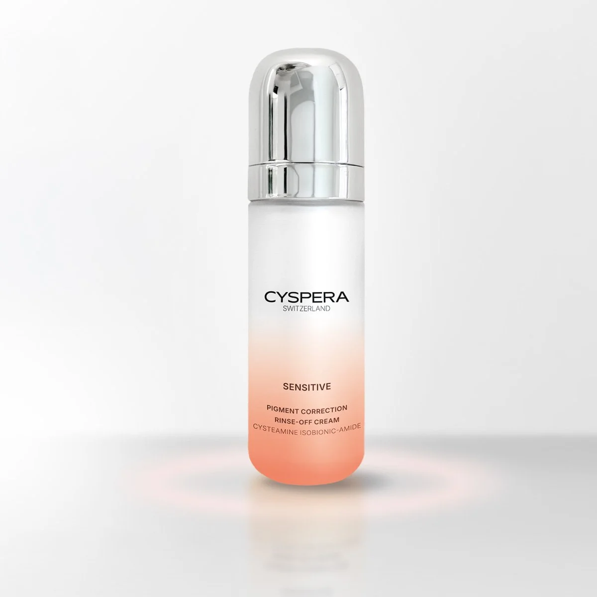 A tall white bottle with a silver cap, labeled CYSERA Switzerland Sensitive Pigment Correction Rinse-Off Cream, with ingredients listed at the bottom.