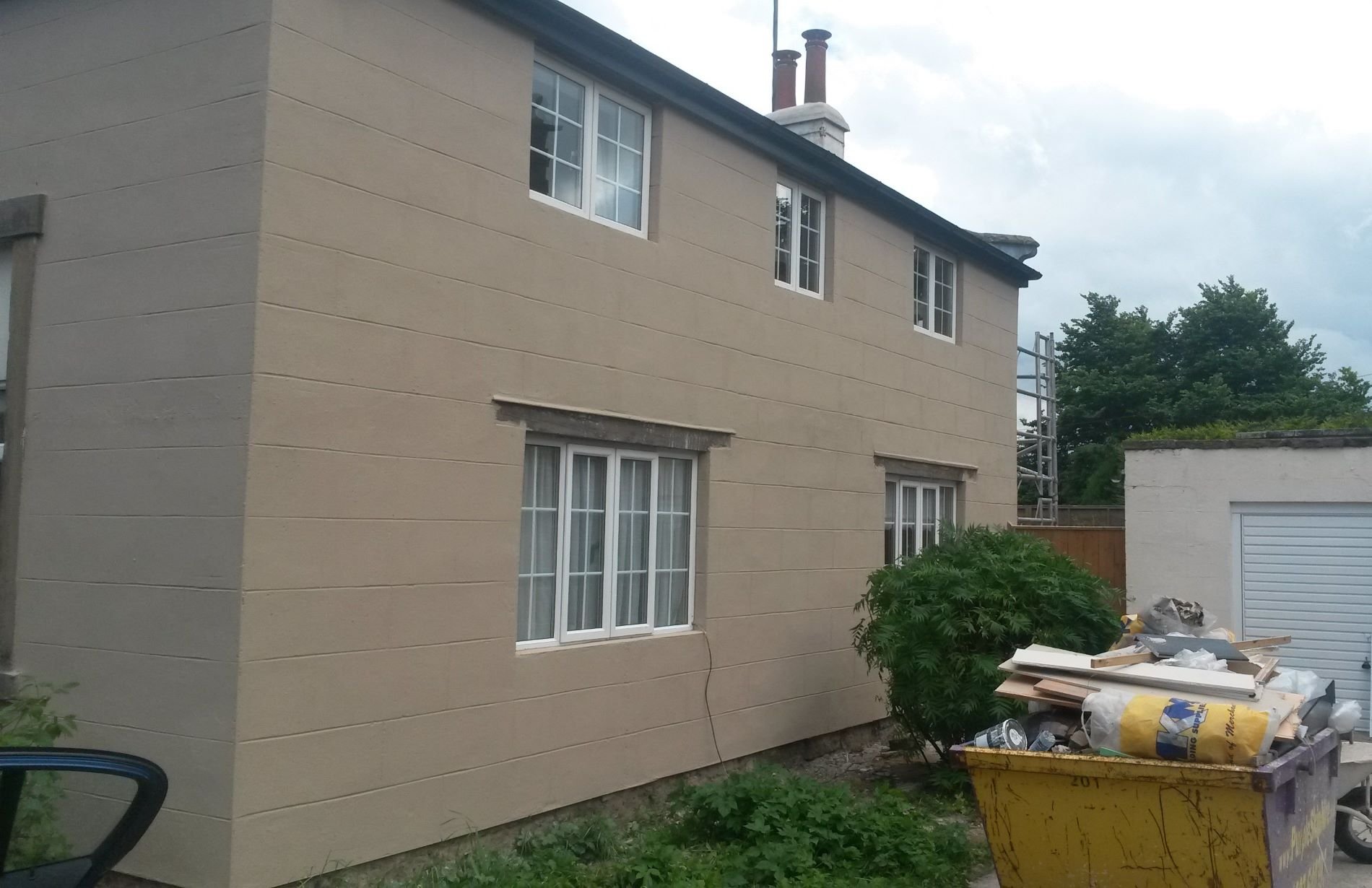 Ashlar cut modern rendering service completed on a detached two-storey Coach House in Whitby by Abbeydale Builders.